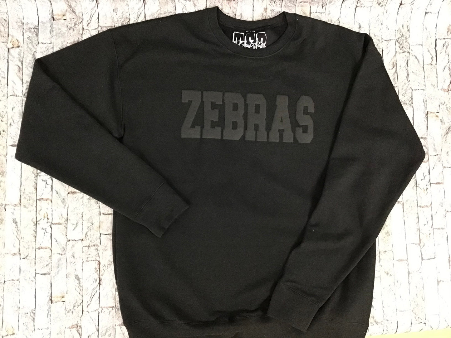 Black on black puff Zebras