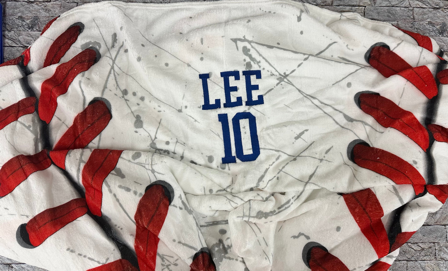Embroidered sports blanket